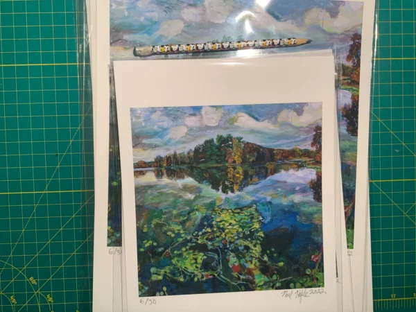 Size comparison of 'Picturesque Prospect Park Lake' giclee prints on cutting mat with pencil