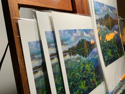 Angled view of 'Picturesque Prospect Park Lake' giclee prints on painting easel