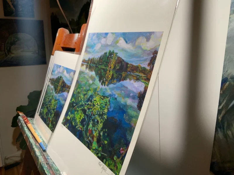 Side angle view of 'Picturesque Prospect Park Lake' giclee prints on painting easel