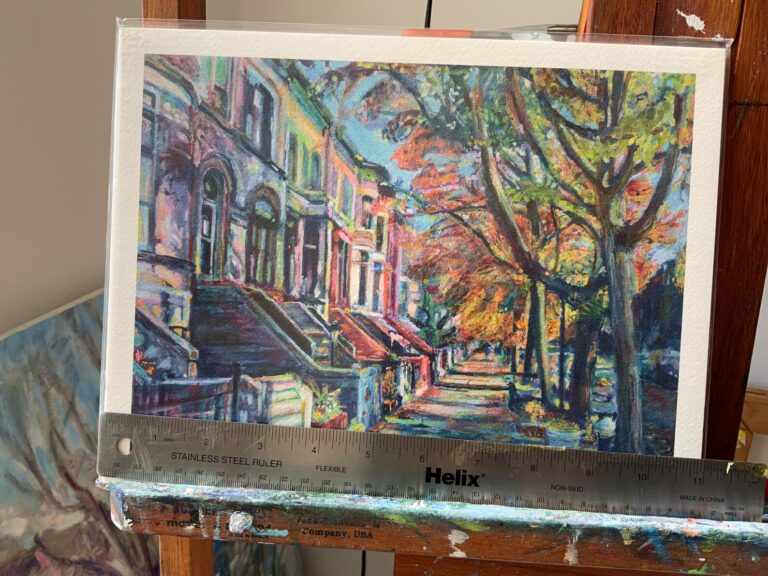 8.5"x11" Midwood Street Brownstones giclee print on painting easel with ruler showing 11" width