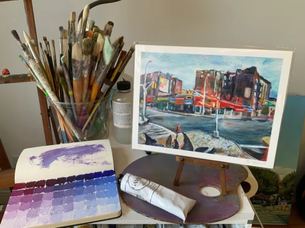 Giclee print of Parkside Ave and Ocean Ave intersection in Brooklyn on artist table with paint supplies