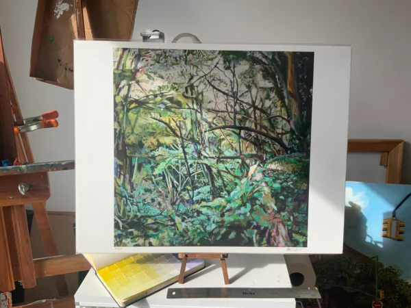 17" x 21" giclee print of "Grove of Trees in Devon, England" on artist's table with studio background
