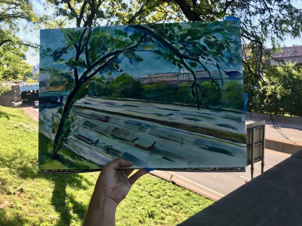 An artist holds up a partially completed painting that blends urban elements with greenery, as cars whiz by on the expressway below