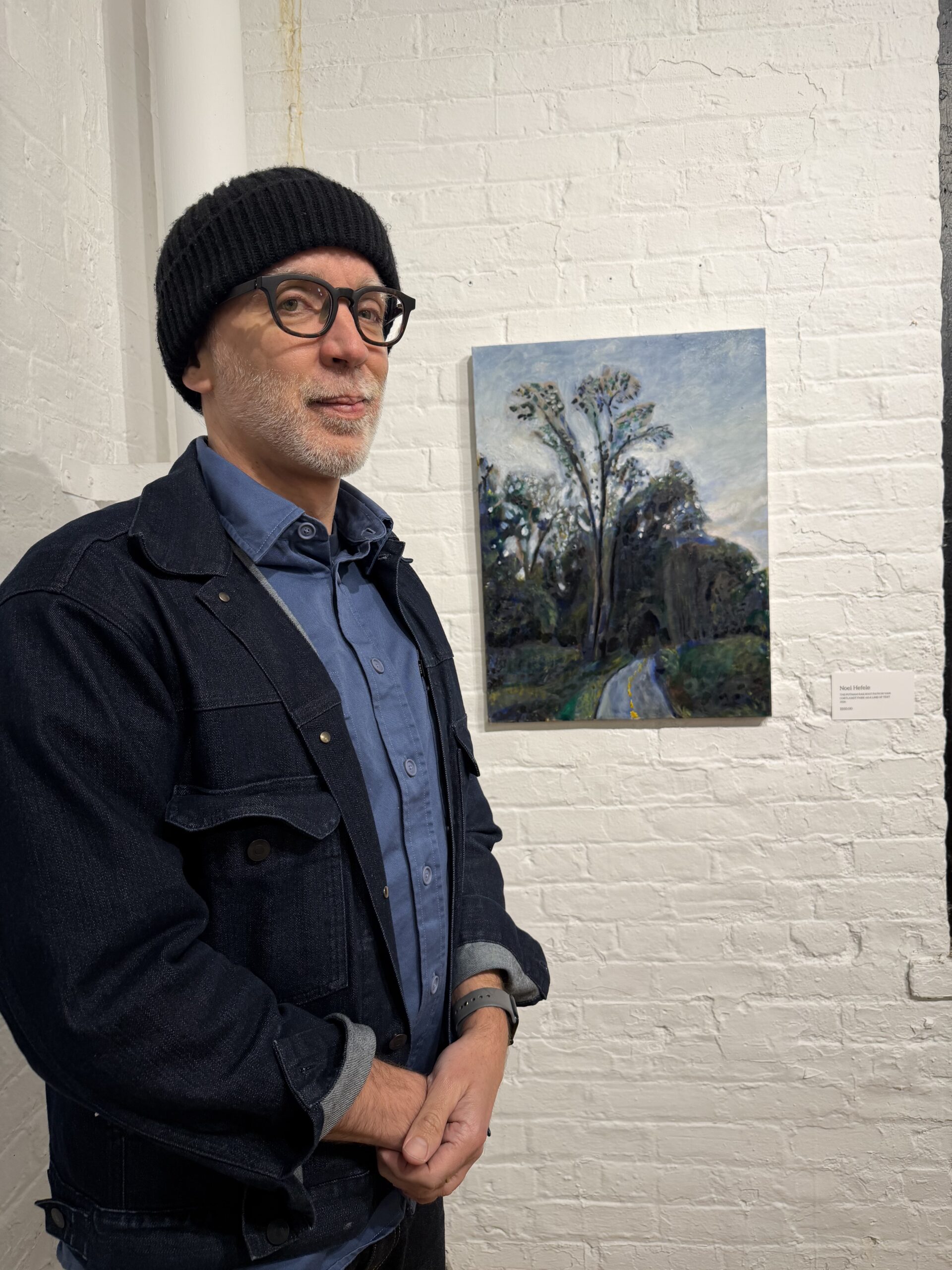 Noel Hefele standing beside his painting Language of Landscape at Yonkers Arts WORDS exhibition, 2026
